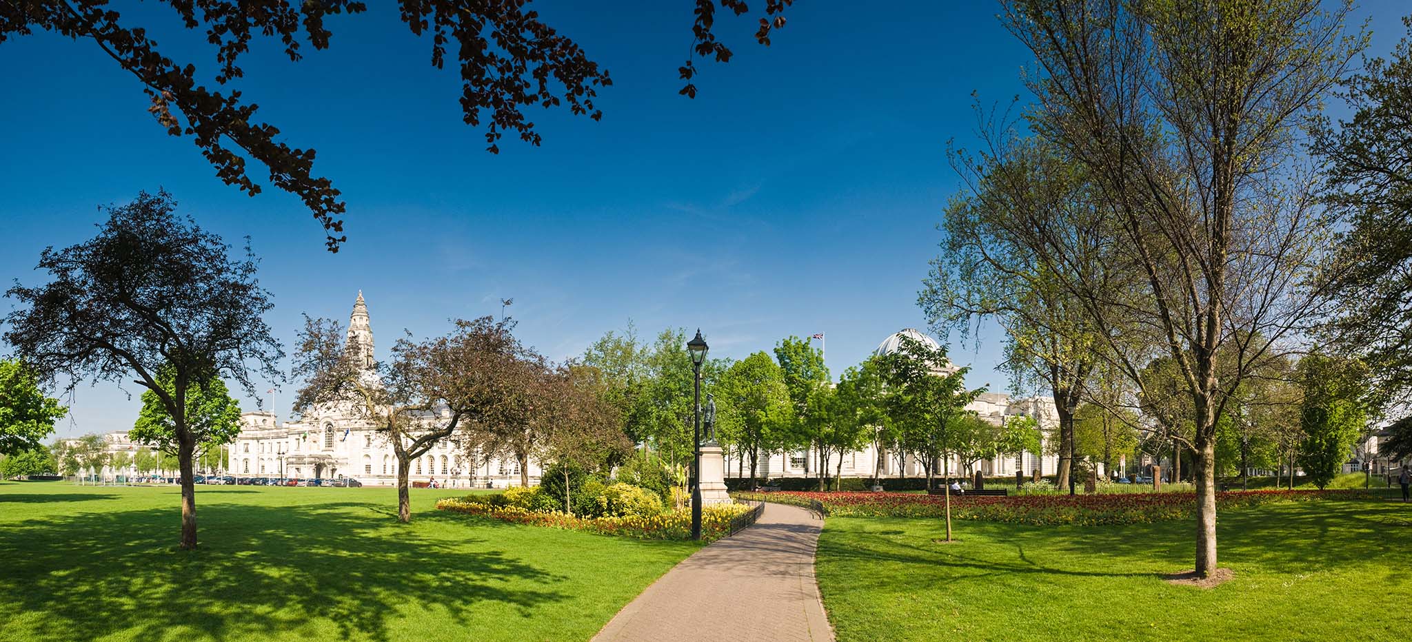 Magnificent City Hall in the heart of the Cardiff Welsh and European flags visible.